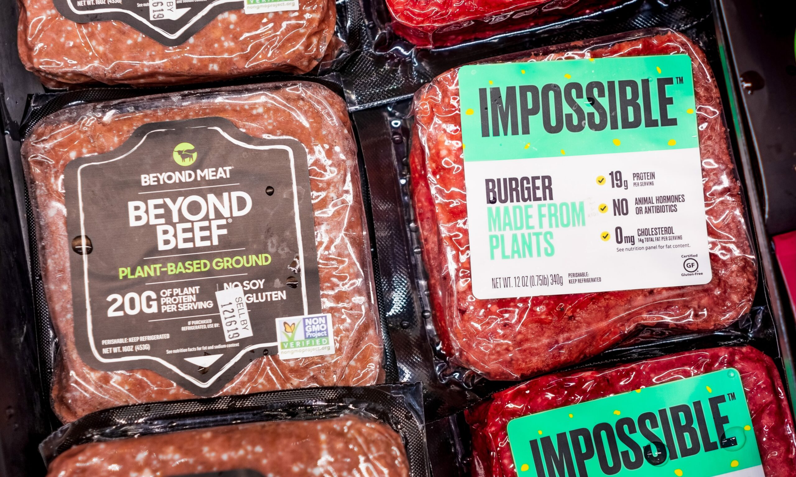 A close up picture of plant based "meat" products made by Beyond Meat and Impossible Foods.