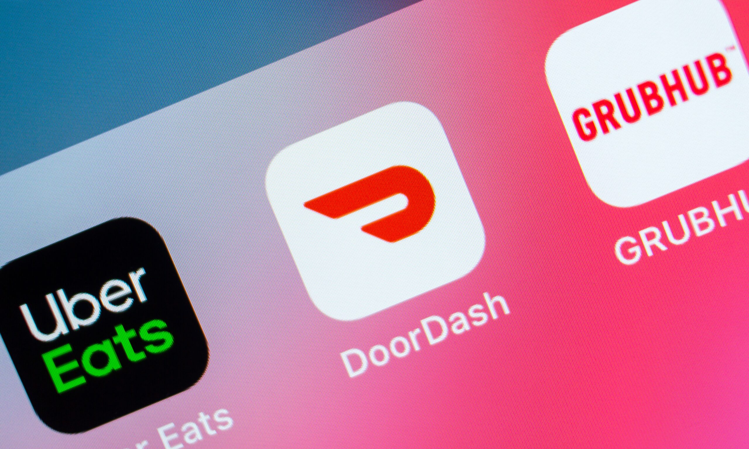 A view of a phone screen featuring Uber Eats DoorDash and GrubHub apps.