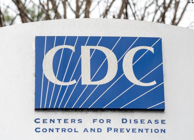 A photo of a sign with the blue CDC logo on it.