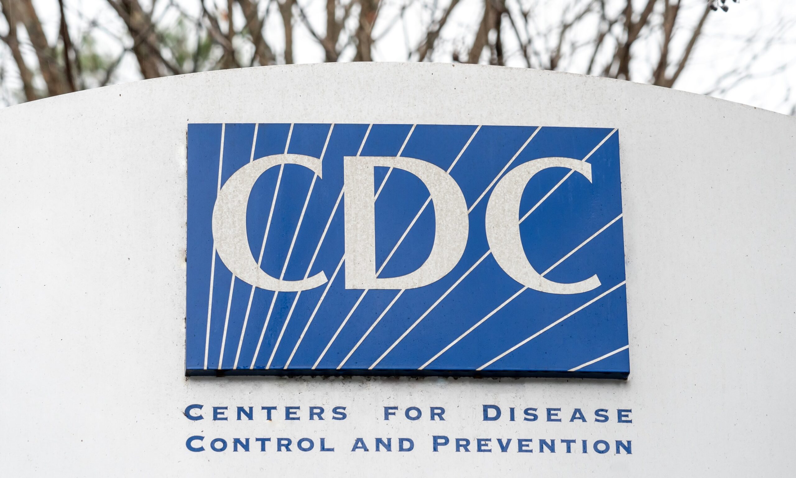 A photo of a sign with the blue CDC logo on it.