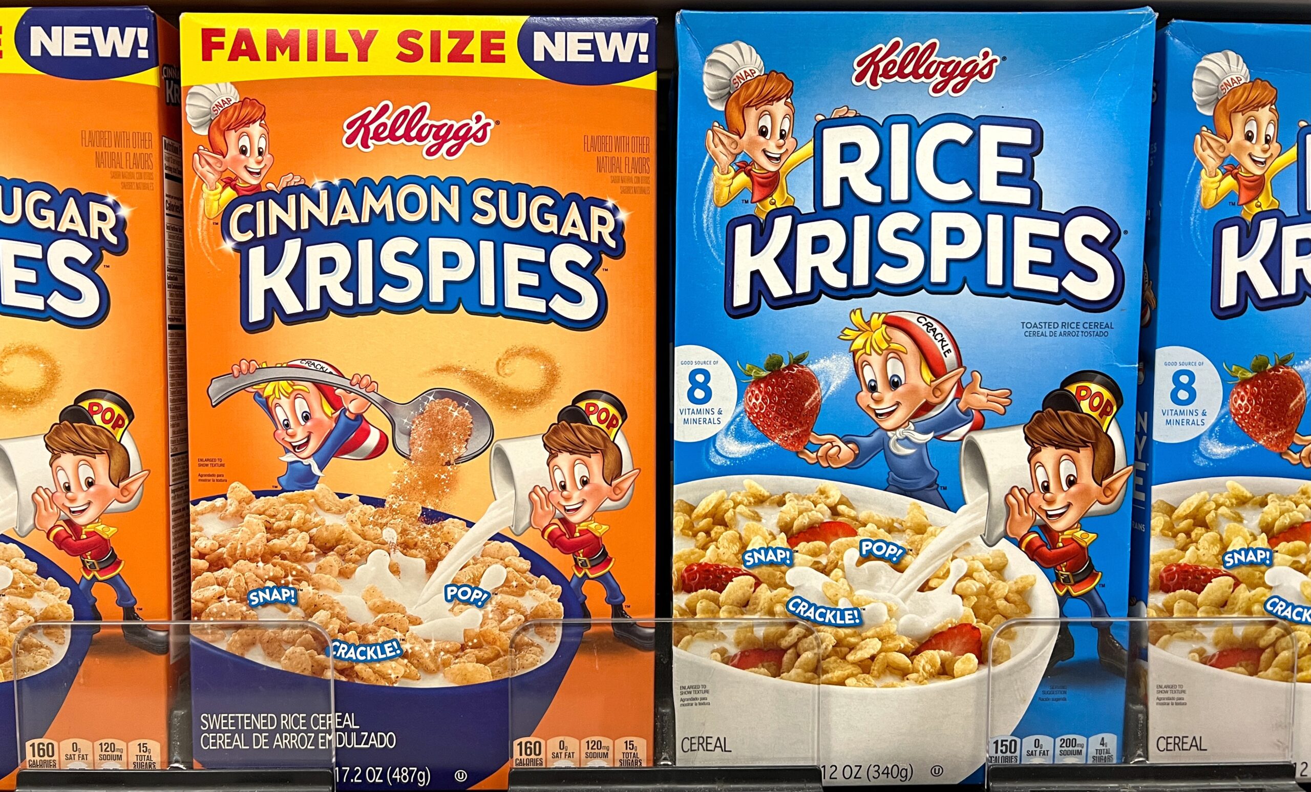 A photo of two types of Rice Krispies boxes. On the left, there's Cinnamon Sugar Rice Krispies, on the right classic Rice Krispies.