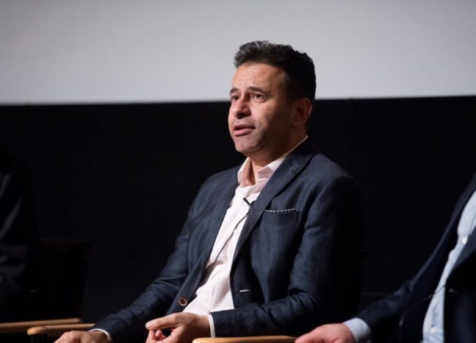 Marty Makary is seated against a black and gray backdrop.