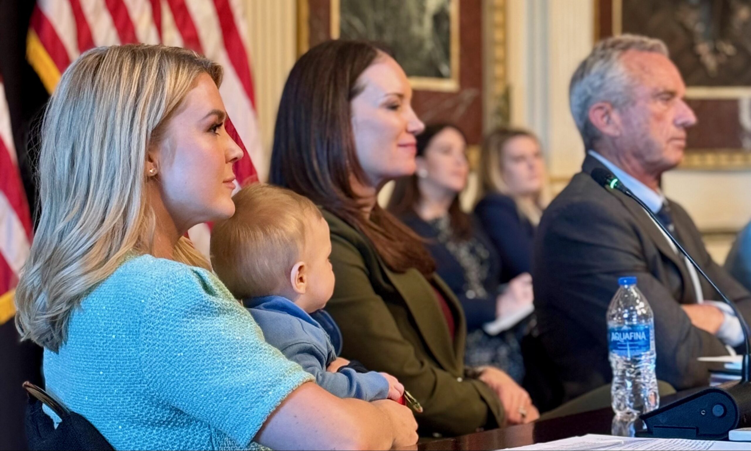 White House press secretary Karoline Leavitt with her baby. Pictured with Ag Secretary Brooke Rollins and HHS Secretary Robert F. Kennedy Jr. Credit: X.